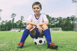 © 3Days2Go Media - Little boy sitting on soccer ball