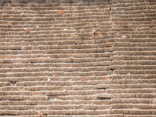 old history brick stone wall exterior Cracked on ancient traditional temple architecture.Textured exterior pattern background with copy space for text.