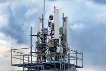 Telecommunication Antennas For Wireless Cellular Mobile And Radio Network Installed At A Transmission Base Station Tower On A Rooftop Of A Building.