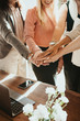 © rawpixel.com - Team of business people stacking hands