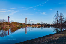 Six Flags Over Texas Reflecting Off A Lake
