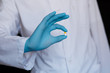 © Ilnur - the pill in the hands of the doctor close-up. gesture ok. Medic gives the pill to the patient