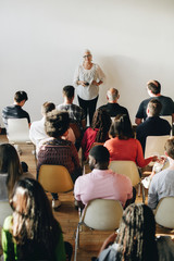 Wall Mural - Senior woman talking in a seminar