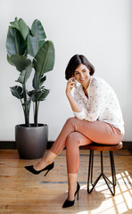 Wall Mural - woman sitting with crossed legs