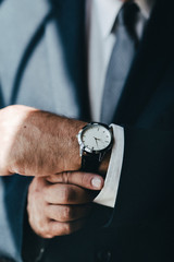 Businessman checking the time