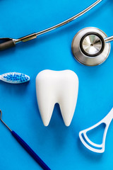 Wall Mural - Dental model and dental equipment on blue background, concept image of dental background. dental hygiene background