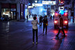 Using her mobile phone, a woman records civil unrest on the streets of Istanbul. 