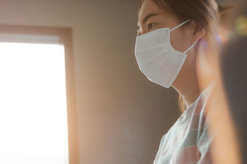 Asian woman wearing protective hygiene mask