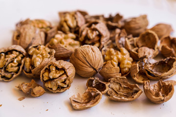 pilled walnut isolated on white background. Composition from nuts on the white isolated background