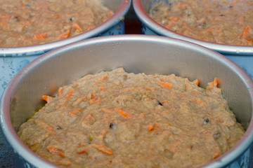 Wall Mural - Raw batter for a vegan carrot cake in a cake mold