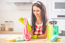 Lazy Housewife Frowning From Disgust To Do Housework, Surrounded By Cleaning Stuff