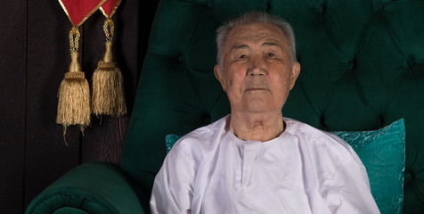 portrait of a religious old man in white clothes