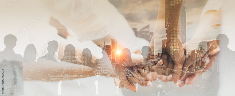 Double exposure panoramic teamwork business join hand together with silhouette business people and modern city background. Business team standing hands together, Volunteer charity work. - obrazy, fototapety, plakaty 