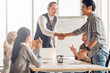© Shutter B - Successful agreement negotiation in business meeting concept. Businessman and asian partnership handshake after finish meeting with happy enjoy laugh smile and great success emotion.