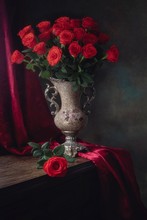 Still Life With Splendid Bouquet Of Red Roses In Vintage Vase
