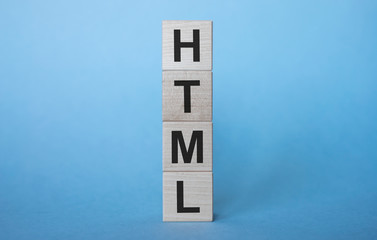 Aufkleber - html inscription on wooden cubes on a gray-blue background
