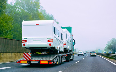 Canvas Print - Truck carrier with motor homes rv on road of Slovenia reflex