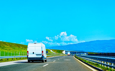 Wall Mural - Mini van in highway road in Slovenia reflex