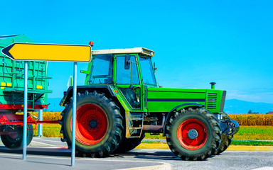 Agricultural tractor on highway road in Poland reflex