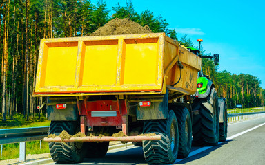 Wall Mural - Tractor carrying sand Poland reflex