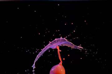 Wall Mural - Hi speed macro photography of water with bright colors dripping and splashing