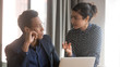 © fizkes - Indian female team leader sharing ideas with african ethnicity male colleague, associates meet in office discuss new project or creative business plan making task together, teamwork brainstorm concept