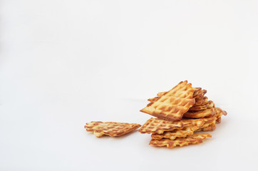 Waffle cookies and seeds isolated on a white background.