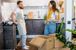 © alfa27 - happy lovely caucasian couple moving into new apartment, do repairs, they unpack boxes together, couple works as a team. family, apartment, house, moving concept