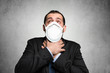 Masked man out of breath, coronavirus pandemic concept