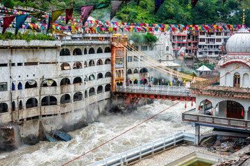 Fototapete - Sikh Gurdwara, bridge over Parvati river and hot springs in Manikaran Sikh sacred site in Himalayas. Himachal Pradesh, India