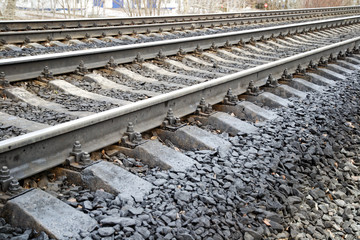 railway wooden sleepers. fastening the rails to the sleepers with bolts.