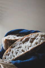 Bread in a basket whit blue cloth