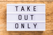 A Sign On A Restaurant Table That Says Take Out Only