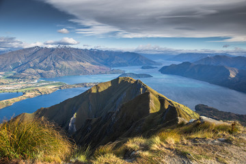 Wall Mural - Roys peak mountain hike in Wanaka New Zealand. Popular tourism travel destination. Concept for hiking travel and adventure. New Zealand landscape background.	