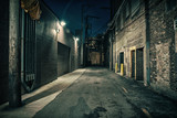 Fototapeta Uliczki - Dark and eerie urban city alley at night 