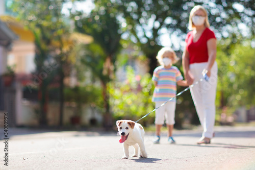 Family walking dog during virus outbreak