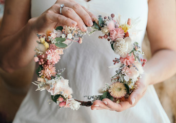 Woman holding flower wreath