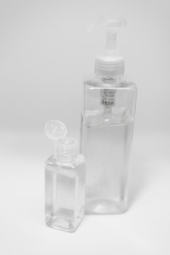 Bottle of instant antiseptic hand sanitizer transparent gel isolated on white background, no label. Antibacterial, hydro alcoholic gel, ethyl alcohol. Mini travel pocket small size, 8 fl oz, 50, 60 m