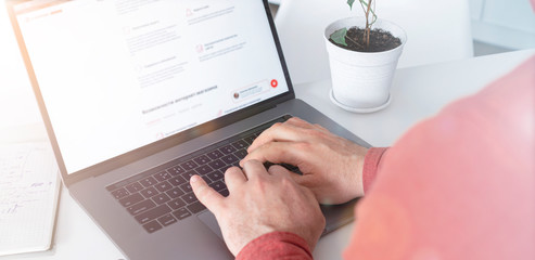 Wall Mural - Man working on laptop in home office