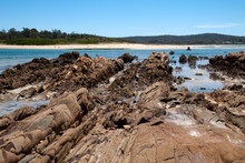 Mossy Point Australia,  Rocky Outcrop Along Beach With View Across Bay