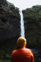 Wall Mural - Traveler by a waterfall