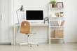 © Seventyfour - Full length view at minimal home office design with wooden chair and white computer desk against white wall, copy space