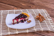 Blueberry cheesecake on wooden table.