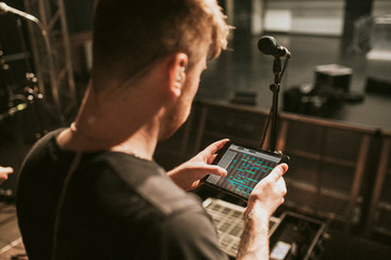 Sound engineer using a tablet