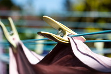 Laundry Out To Dry Pegged To A Rotary Airer On A Warm Sunny Spring Day With Sallow Depth Of Field
