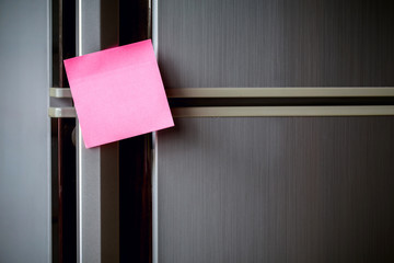 Empty paper sheet on refrigerator door with magnetic clip paper note for add text message.