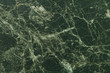 Texture of dark green marble for tabletop with olive lines of a pattern, macro background. Artificial stone countertop.
