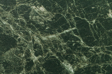 Wall Mural - texture of dark green marble for tabletop with olive lines of a pattern, macro background. artificia