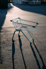 The trolley parking on the street at car park during sunset.