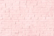 Pastel pink brick wall textured background